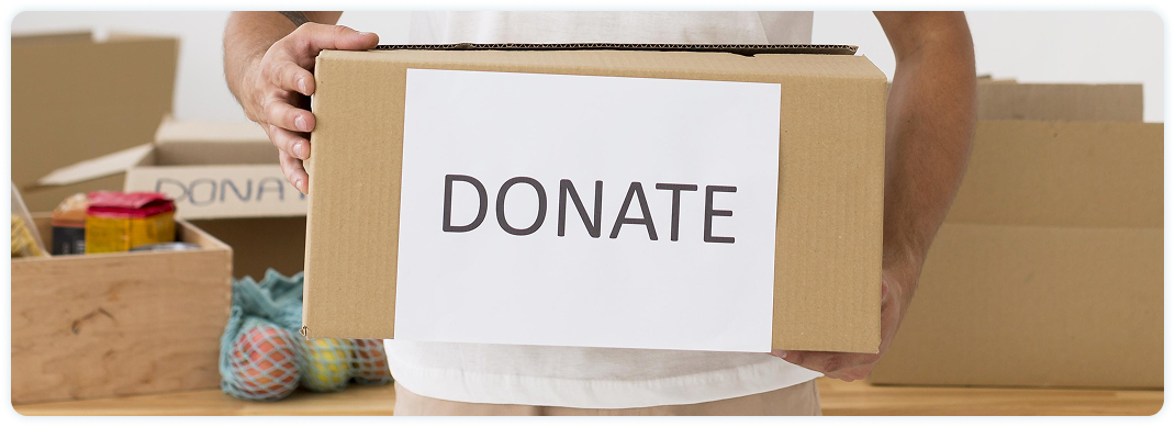 happy-volunteer-holding-donate-box